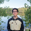 Yuxiang Lin in front of a pond