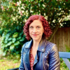 Sharon Dewitte outside on a park bench