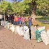 Volunteers-pose-with-trash-bags