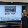 Katie McGuire in front of her PowerPoint