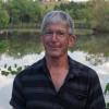 Doug in front of a pond