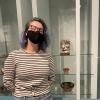 Ella Stritzel in front of a display case