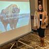 Kesley in front of her paper presentation