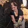 Dr. Hosek during the excavation and relocation of the Loretto Heights Cemetery in Denver (June 2022). She is holding one of the crosses affixed to the original coffins.