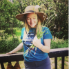 Kelly Zepelin holding some wild onion standing on a deck