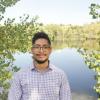 Nicholas Puente in front of a pond