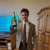 Rob Weiner toasting a champagne bottle