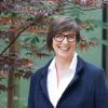 Susan Erikson next to a tree
