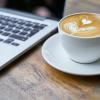 Coffee cup and computer