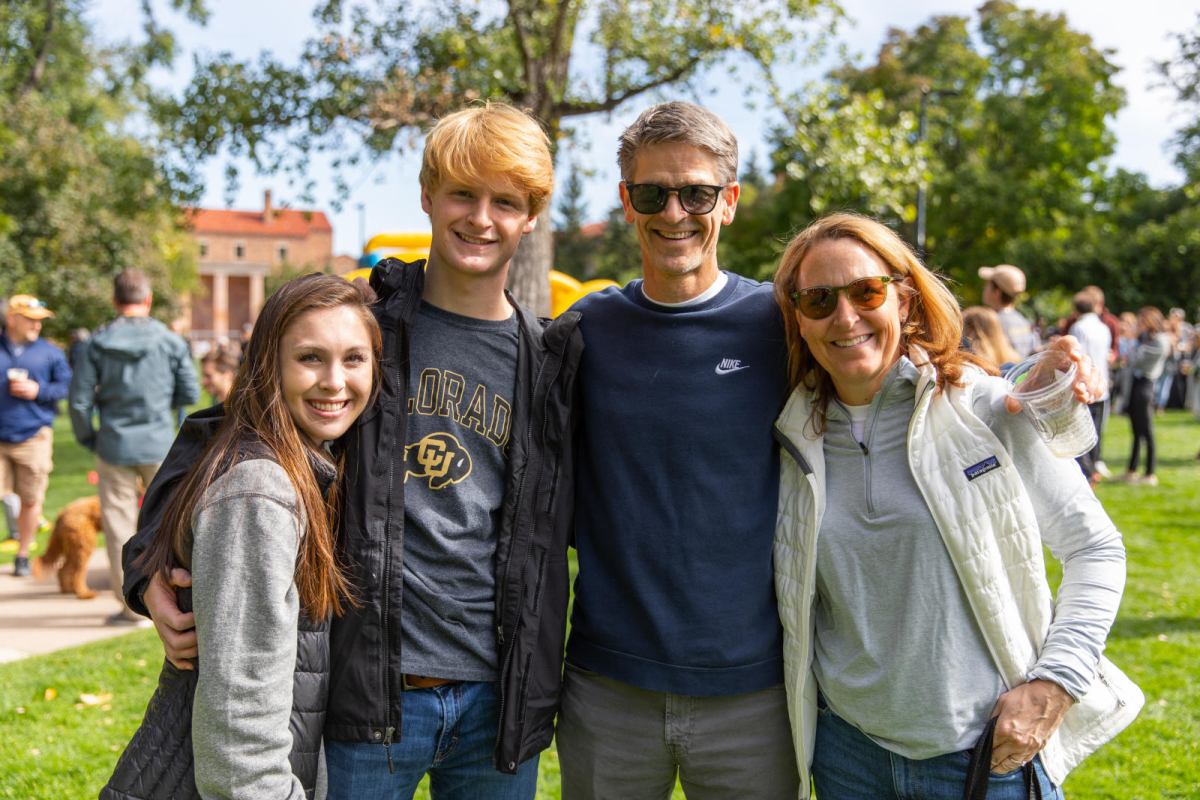 students and their families in a park