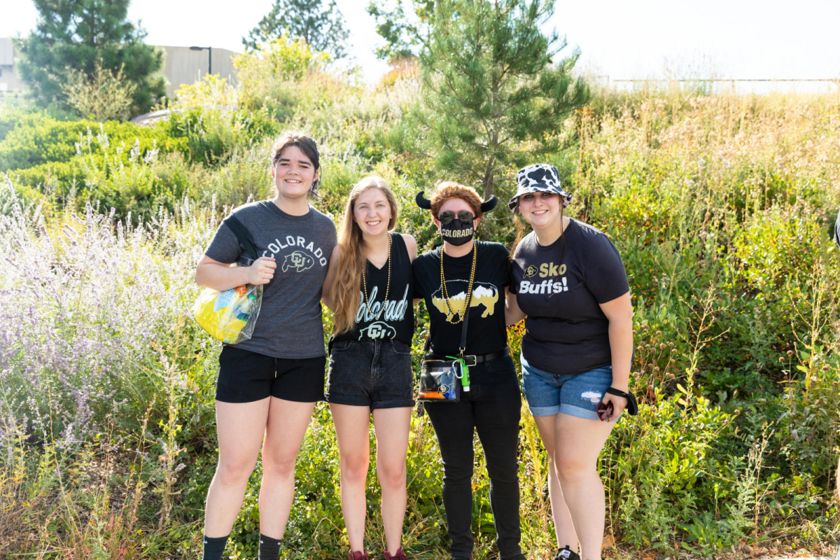 students outside smiling in the park