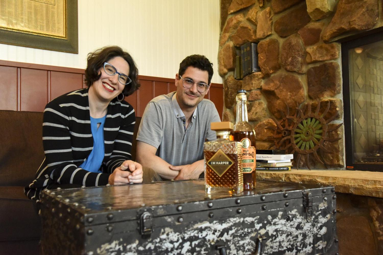 Janice Fernheimer and JT Waldman sitting besides each other and smiling