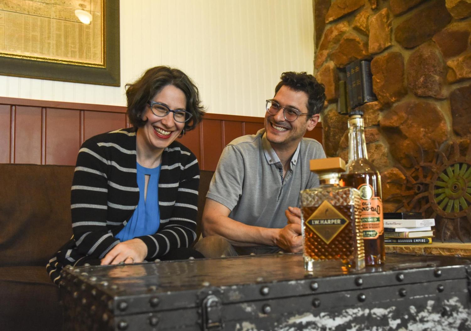 Janice Fernheimer and JT Waldman sitting besides each other and smiling