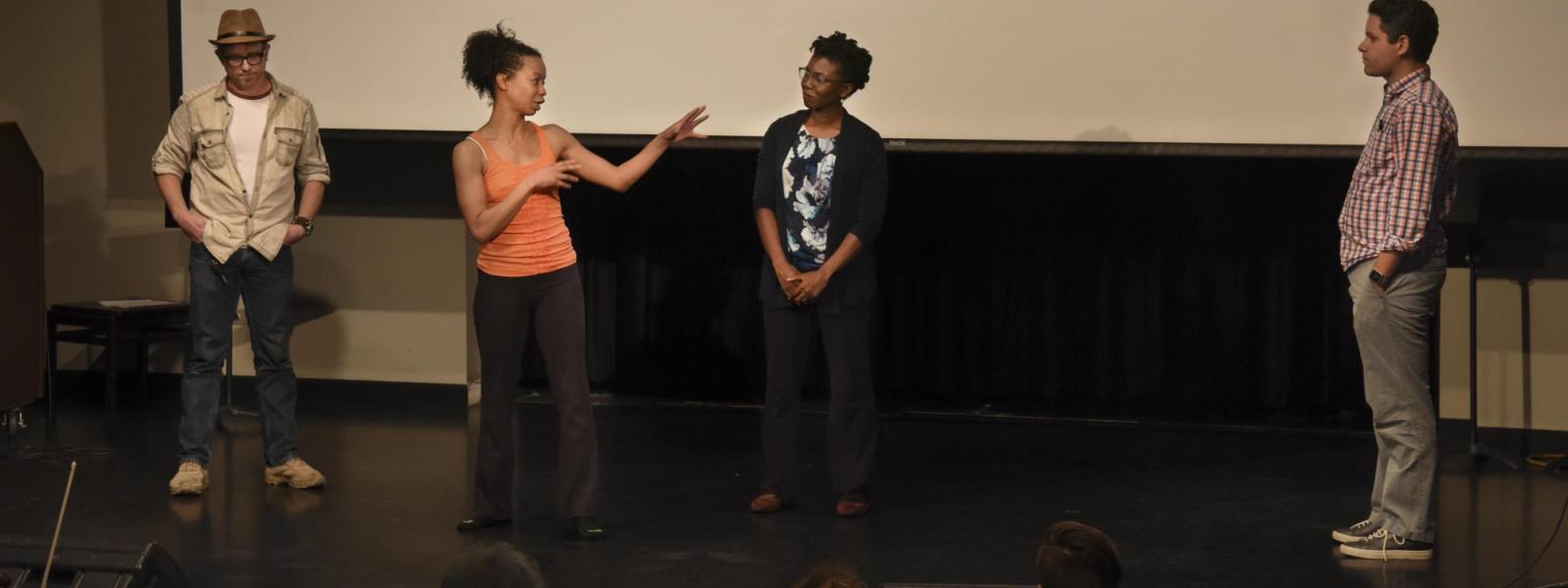 Gesel Mason and her colleagues standing on the stage