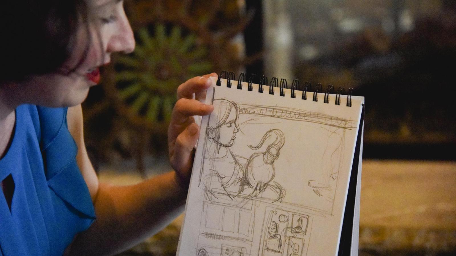 Janice Fernheimer holding JT Waldman’s sketch from America’s Chosen Spirit