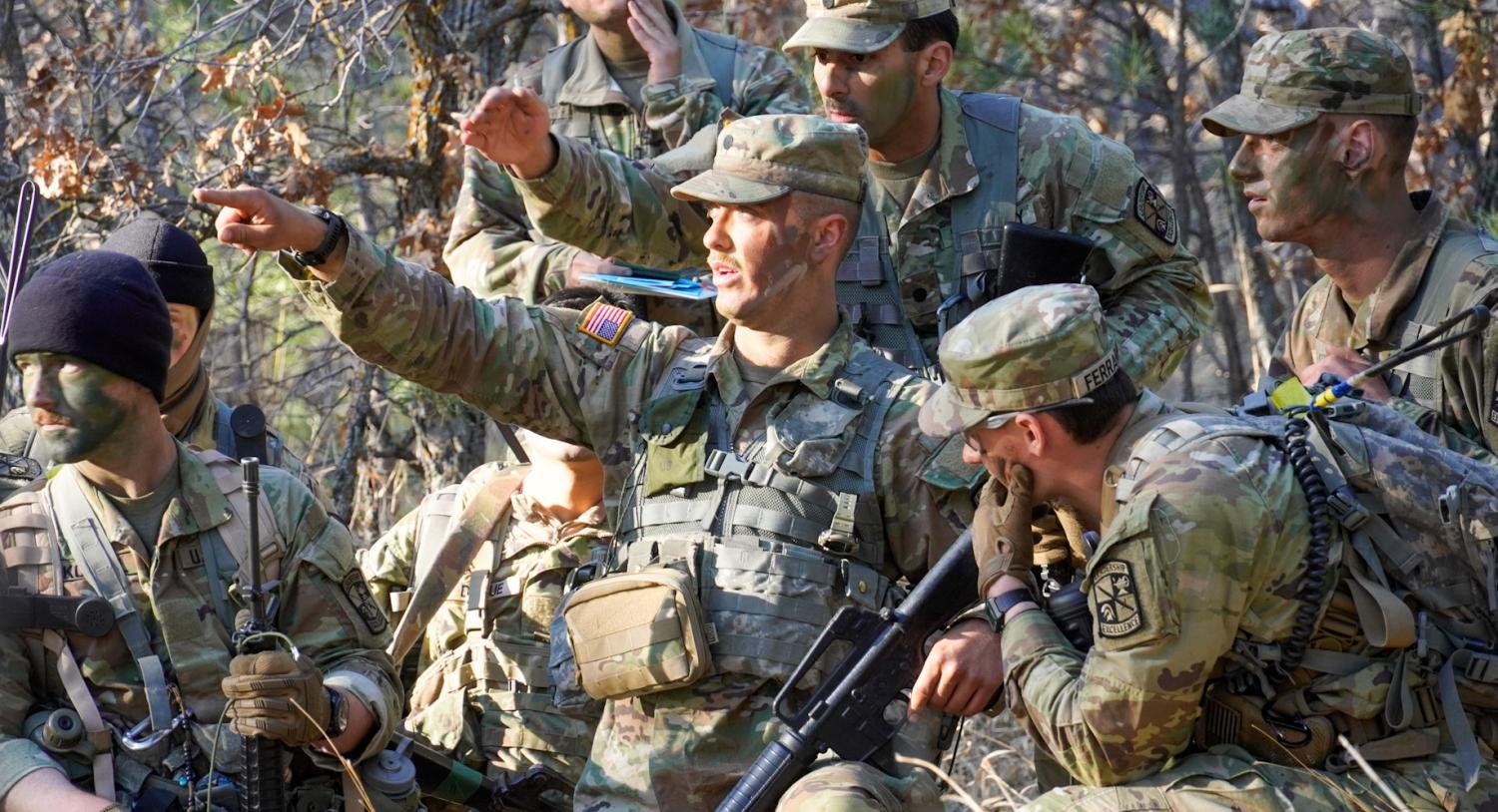 Army ROTC Leader Development Exercise (LDX) Spring 2024 – Cadet Roy (photo center) discusses potential routes to take to successfully get his squad through the patrol base training lane. Photo courtesy of Cadet William Vlad.