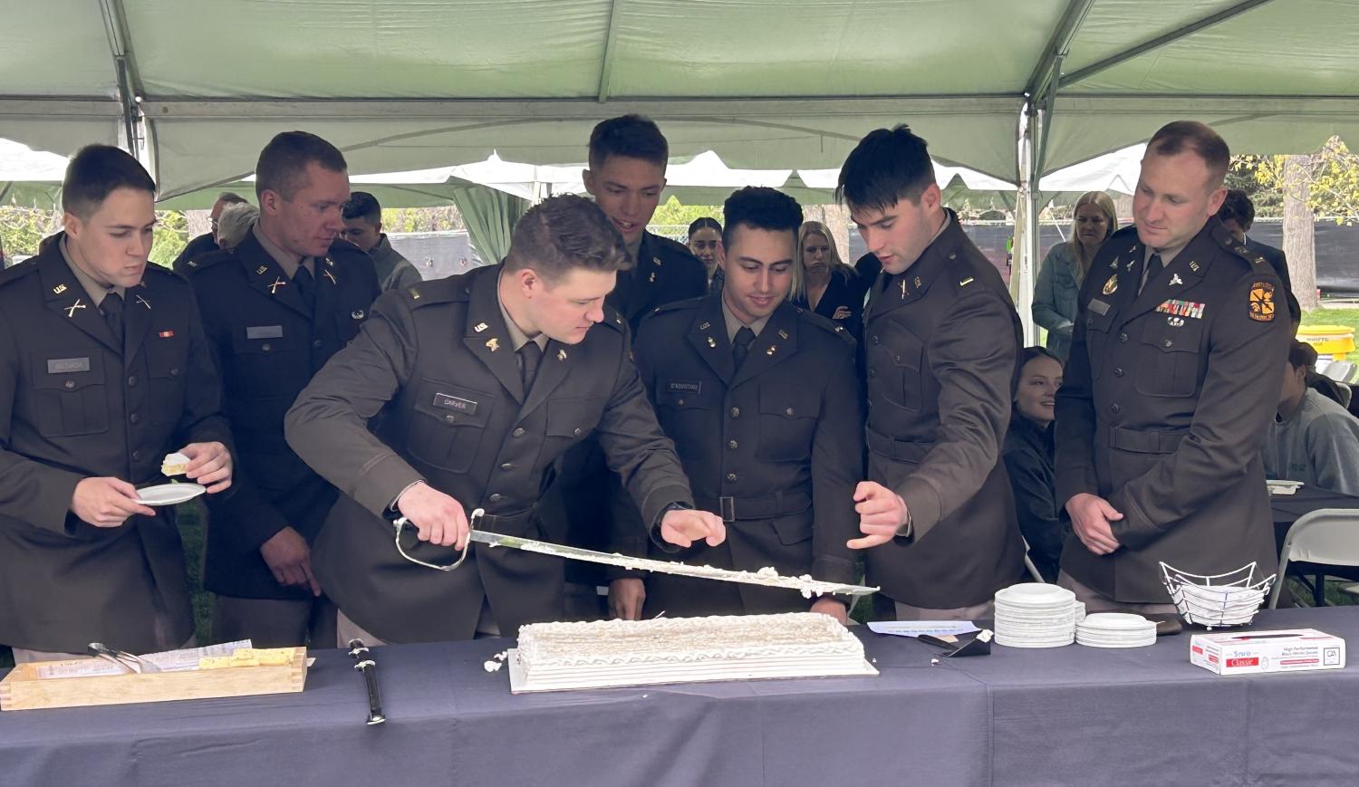 Army ROTC Spring 2024 Commissionees [from left to right]: 2LT Biesiada, 2LT Smith, 2LT Carver (holding sword), 2LT Uren, 2LT D’Agostino, 2LT McDermott, and 2LT Vlad (2LT Morehart not pictured). Photo courtesy of the Golden Buffalo Battalion.