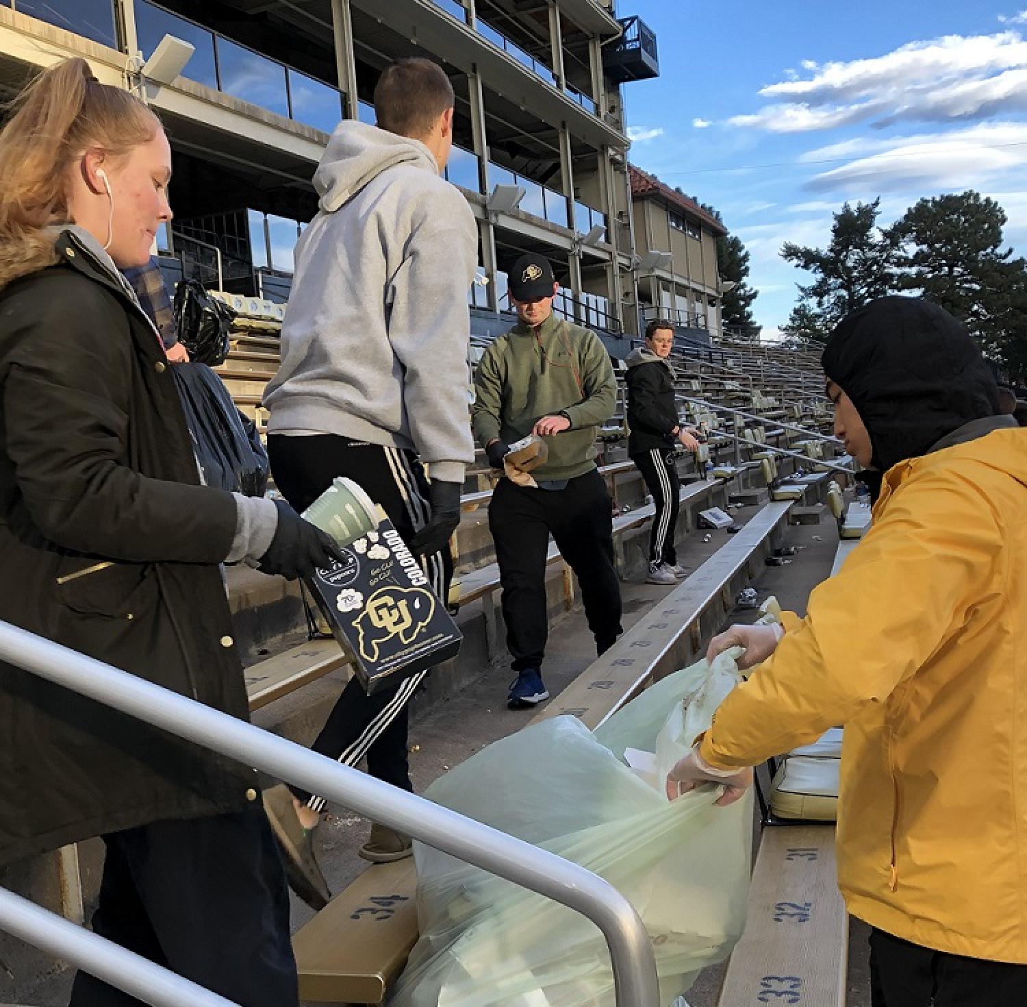 Army ROTC Cadets picking up the recycling and waste left in the stands after the last home football game of the 2019 season.