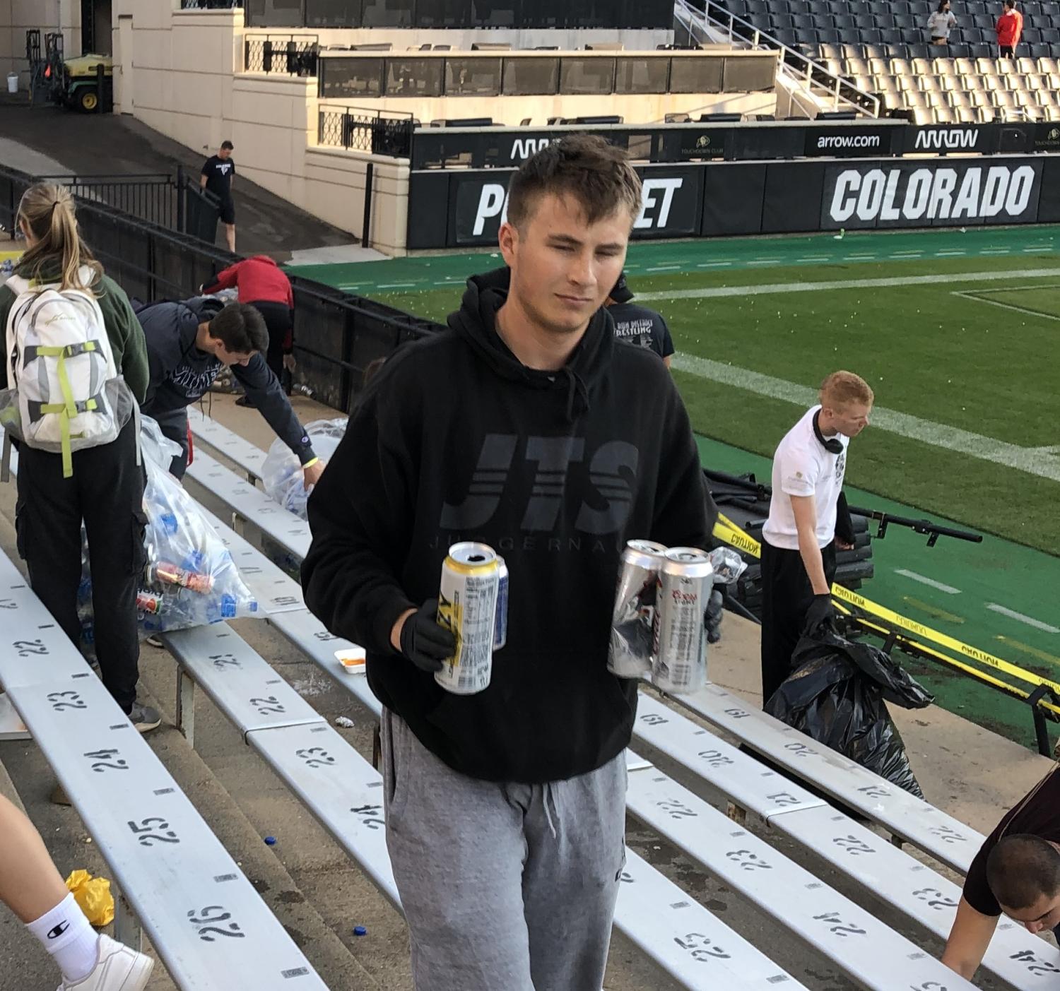 Army ROTC Cadets picking up the recycling and waste left in the stands after the second home football game of the 2021 season.