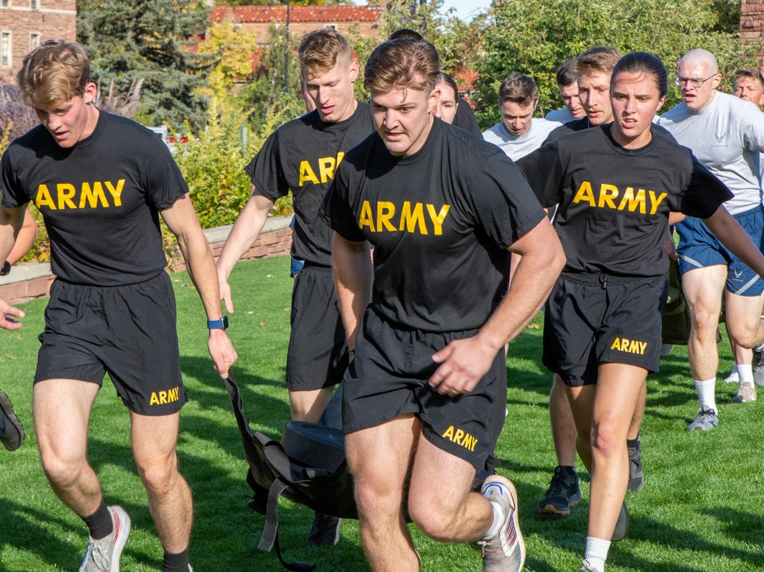 Army Cadets work together to run the litter carry around the field. Photo courtesy of AROTC Cadet Arianna Decker.