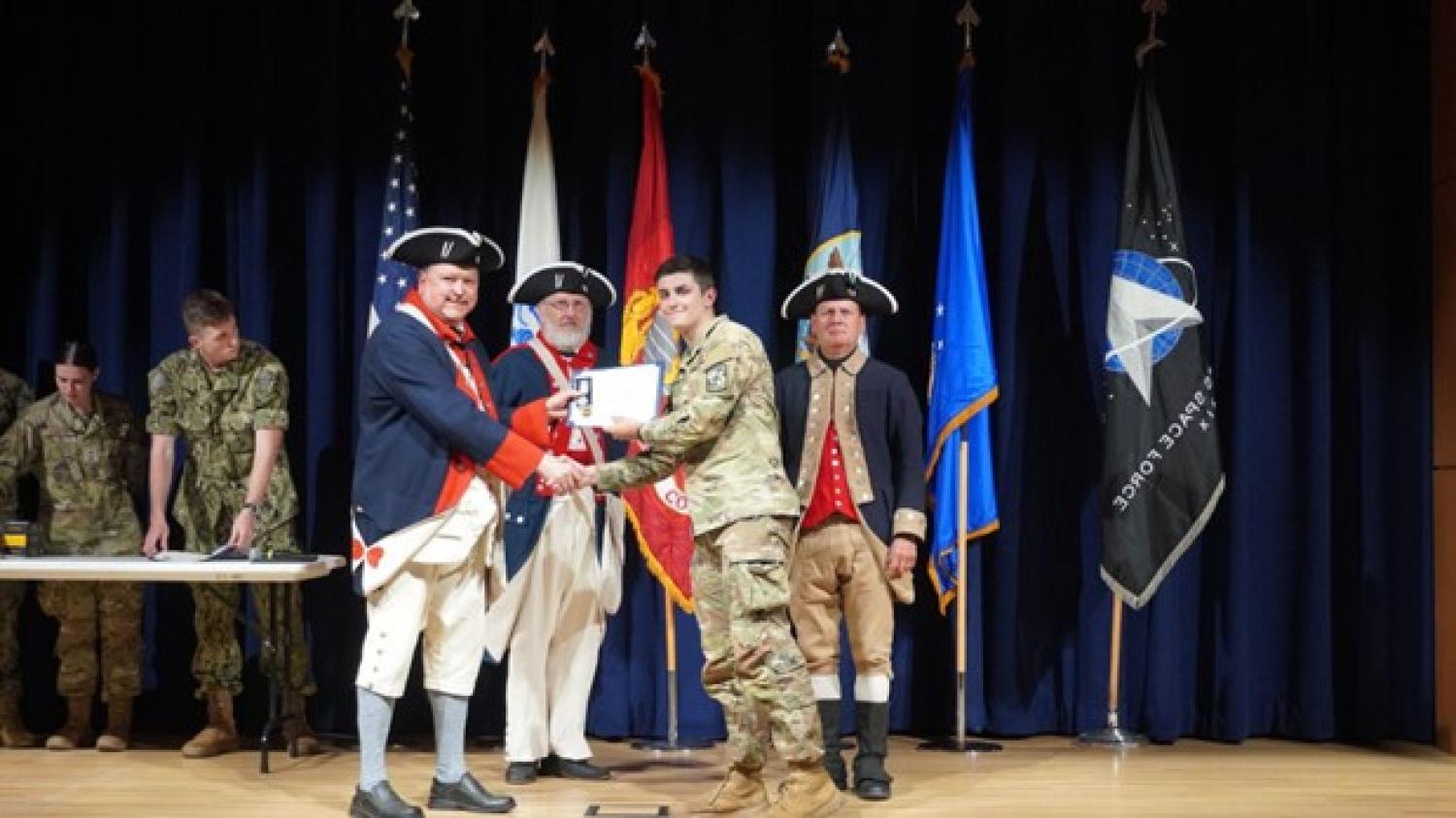 MSII Harrison Collier receives an award during the Tri-Mil Awards Ceremony from Sons of the American Revolution.