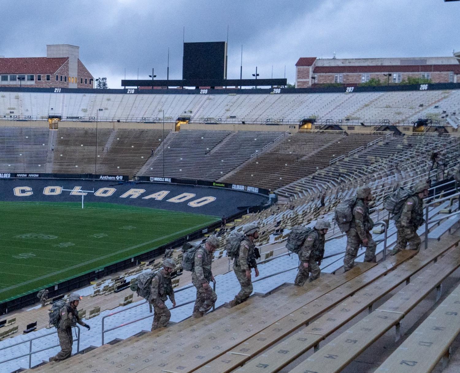 Army ROTC Cadets with full ruck gear running up the stairs at Folsom Stadium. Photo courtesy of CDT William Vlad.