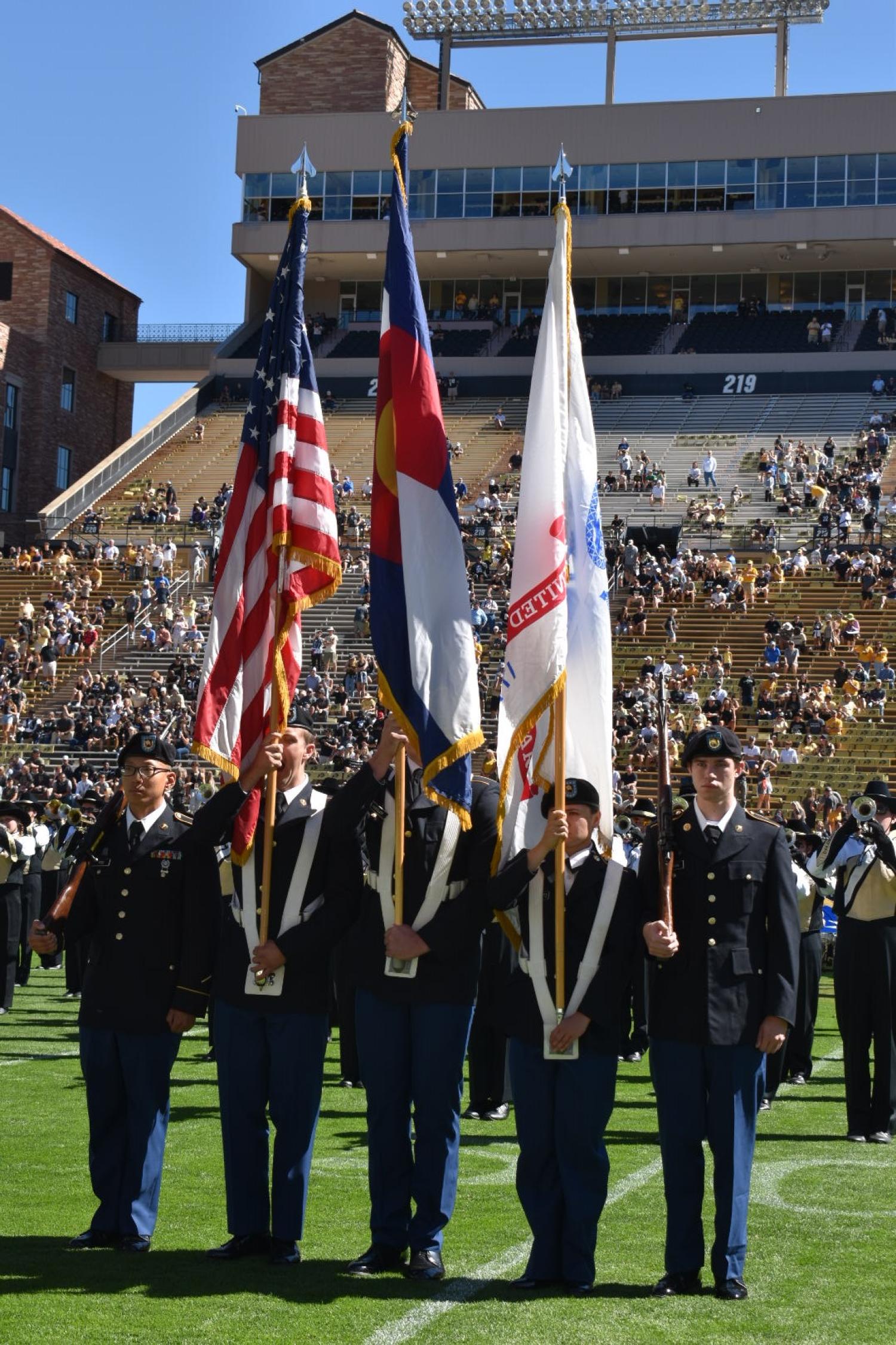 Army ROTC Color Guard Cadets display the colors in front of the CU band at Folsom Stadium on September 24th at the CU football game against UCLA. Photo courtesy of CPT Chris Head.