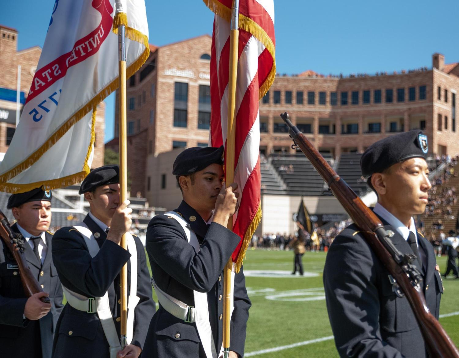 Army ROTC Color Guard Cadets march down the sideline on Folsom Field to display the colors at the October 2nd CU football game against USC. Photo courtesy of Cadet Arianna Decker.
