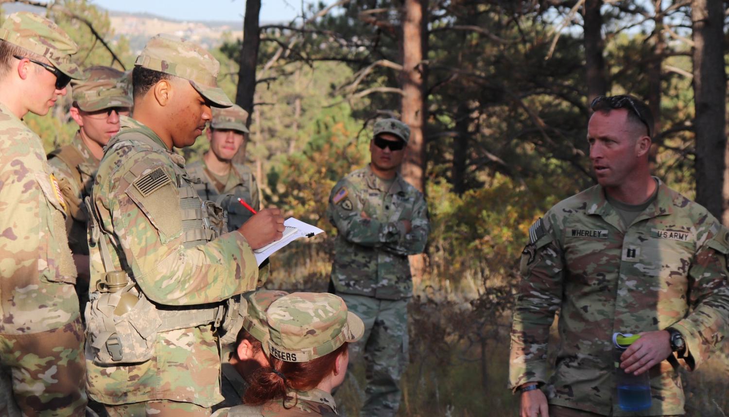CPT Wherley conducting pre-FTX CONOP with the Cadets in charge of planning the FTX. Photo courtesy of AROTC Cadet Preston Miglaw.