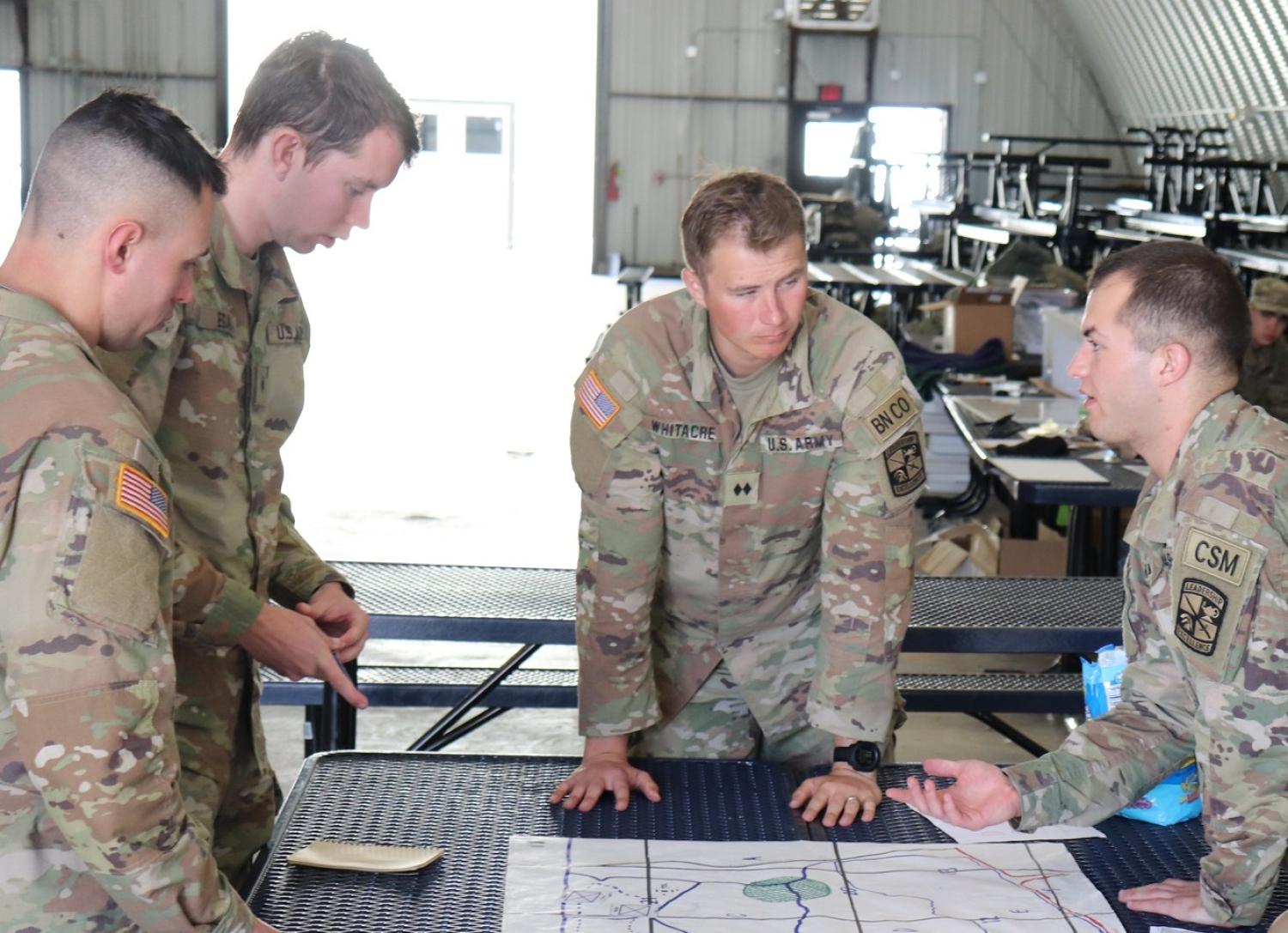 Cadets in charge of FTX go over the final plans for the day. Photo courtesy of AROTC Cadet Preston Miglaw.
