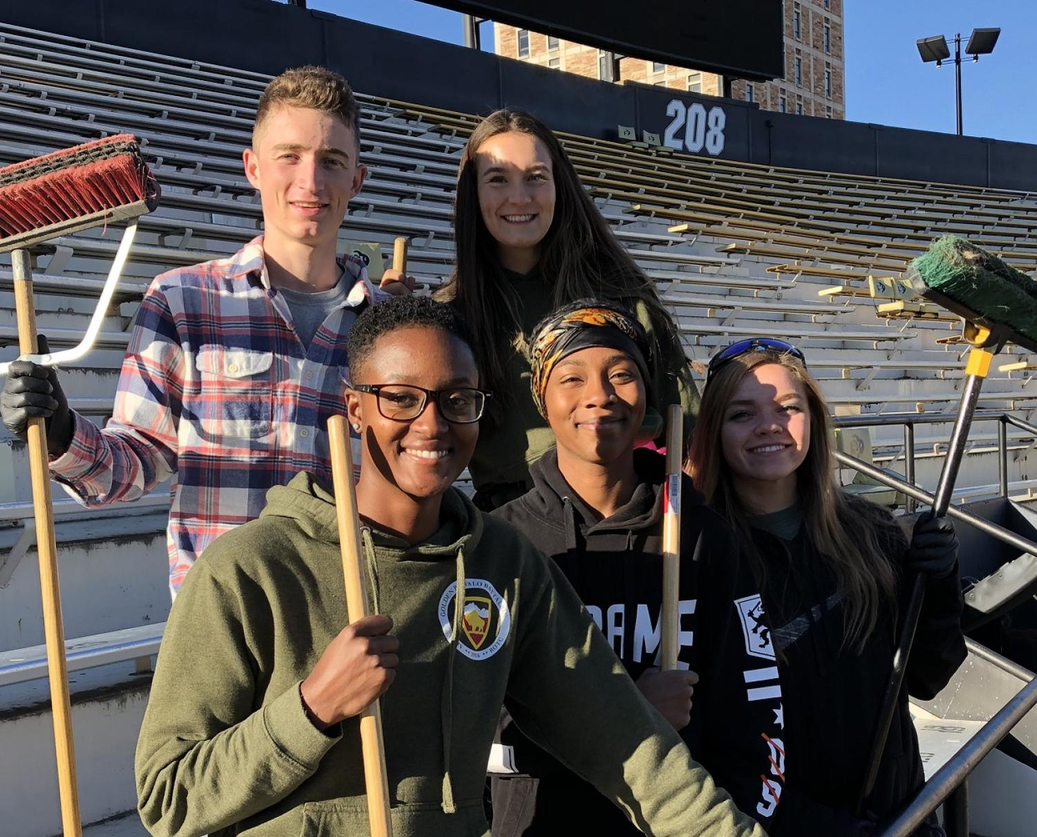 Army ROTC Cadets smile for the camera before going back to their sweeping duties. Photo courtesy of the Golden Buffalo Battalion.