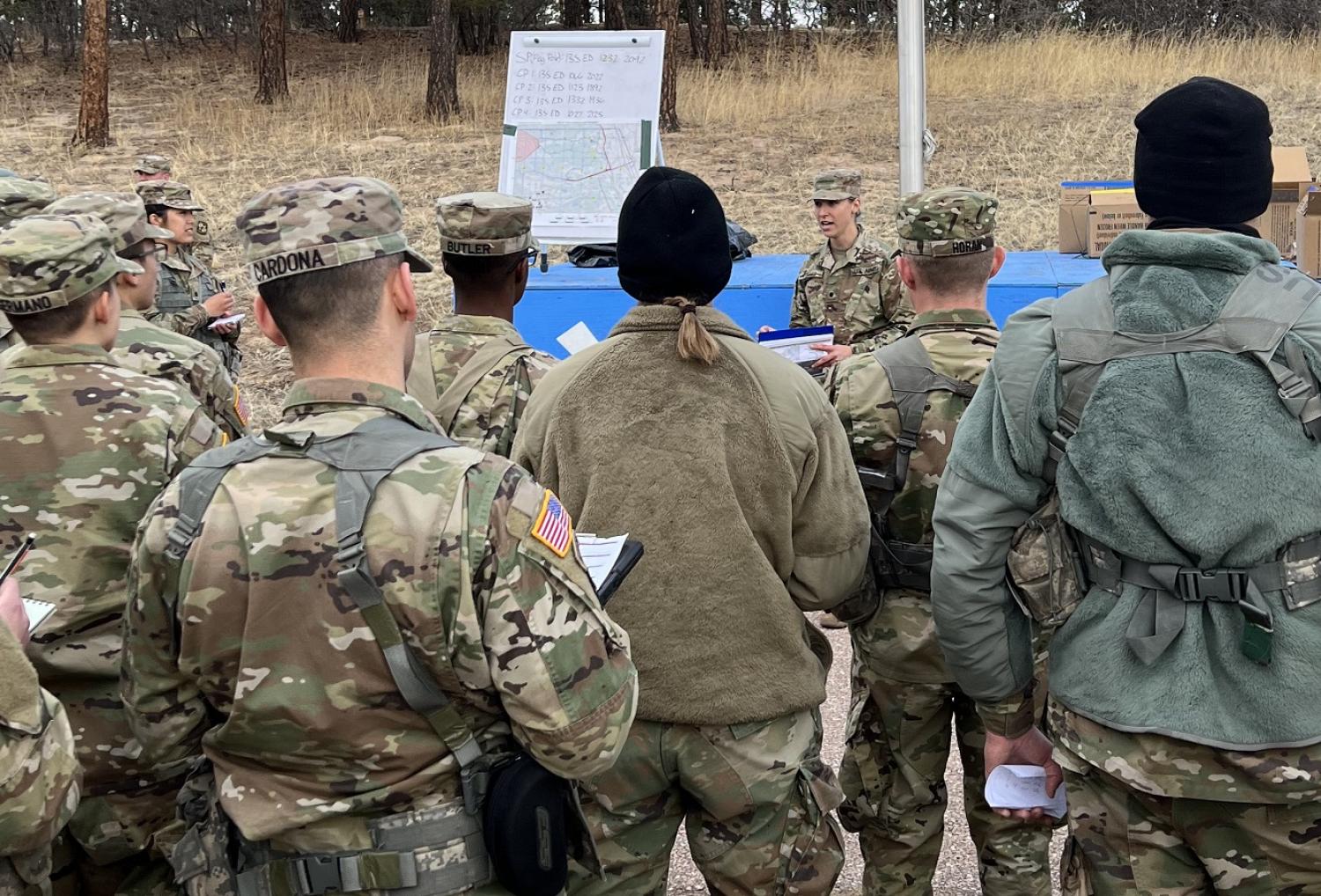 Cadets listen to directions as they prepare to conduct several land navigation lanes. Photo courtesy MAJ Jenn Staton.