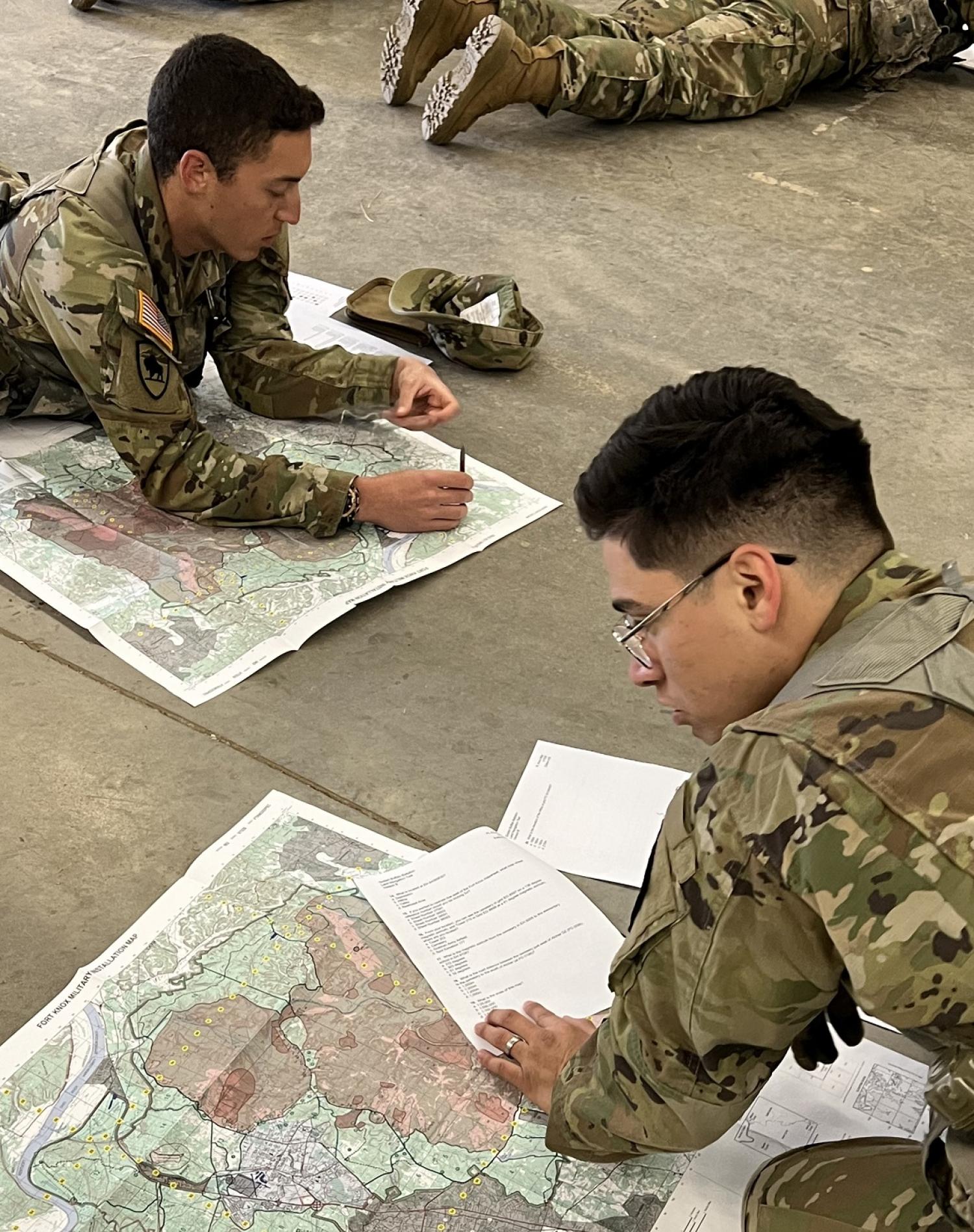 Cadets working on the written portion of the land navigation testing. Photo courtesy of MAJ Jenn Staton.