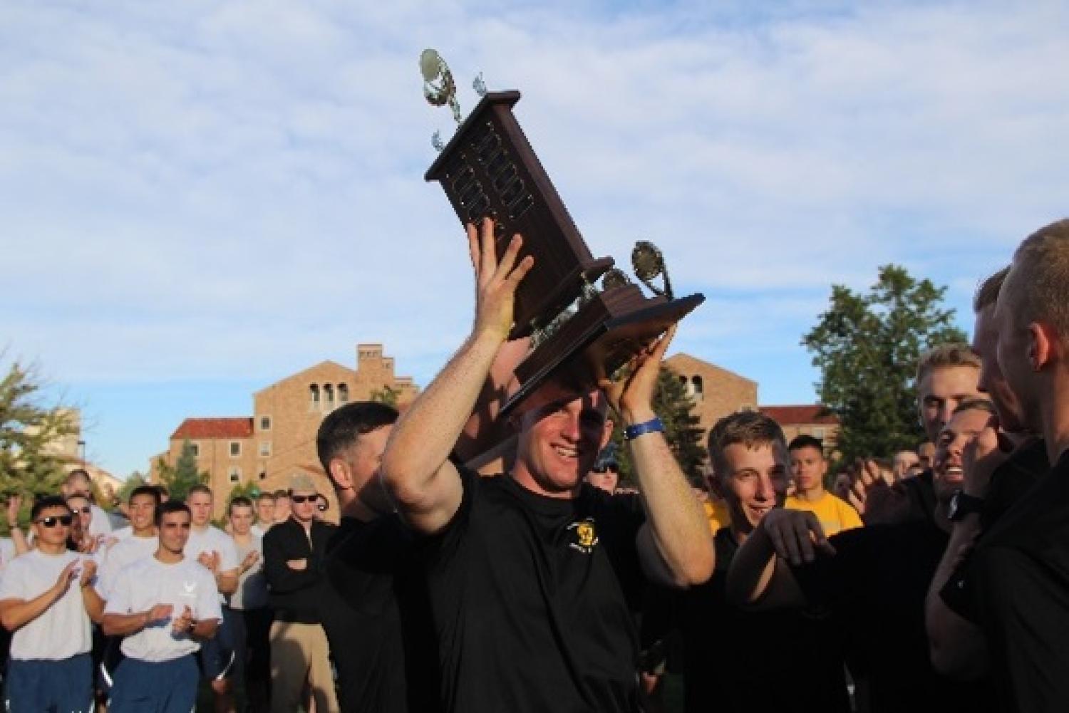 Army ROTC carrying trophy after winning the Tri-Mil Competition.