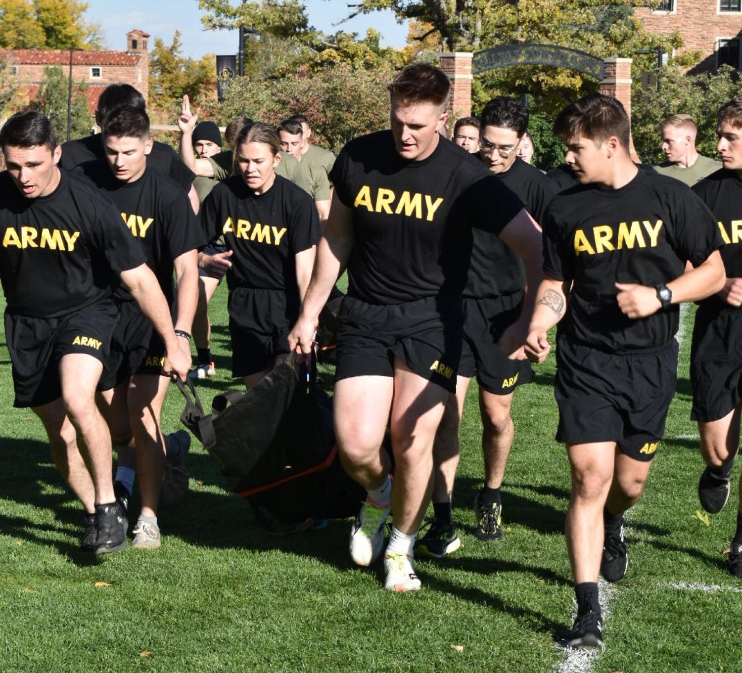 Army Cadets work together to run the litter carry around the field. Photo courtesy of AROTC Second Lieutenant Chantel Phipps.