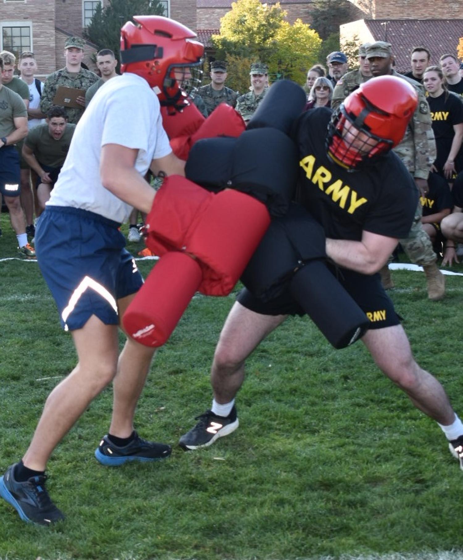Pugil stick match between an Army Cadet and an Air Force Cadet. Photo courtesy of AROTC Second Lieutenant Chantel Phipps.