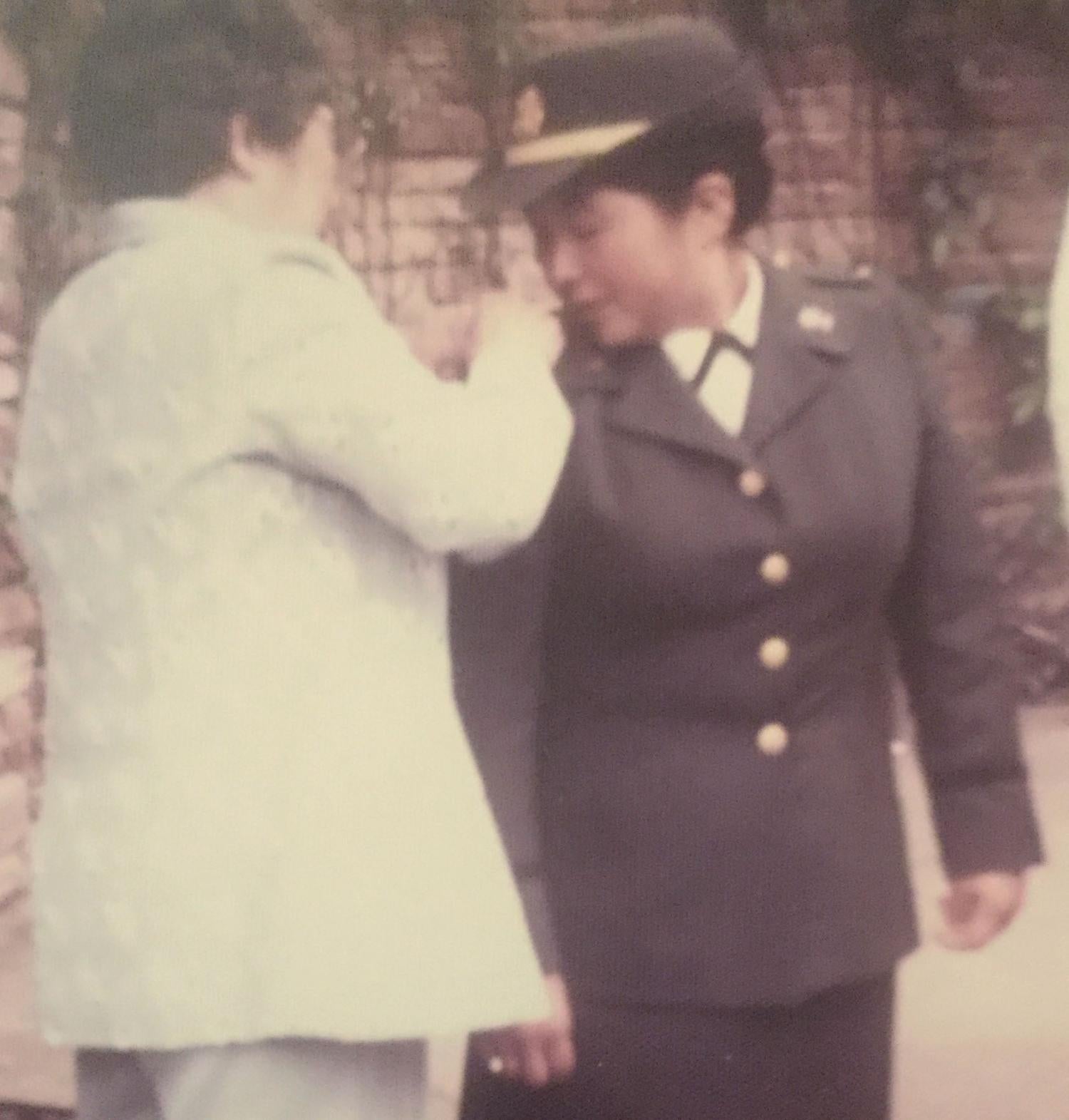 Cadet Rigby having her 2LT bars pinned on by her mother at her commissioning ceremony.