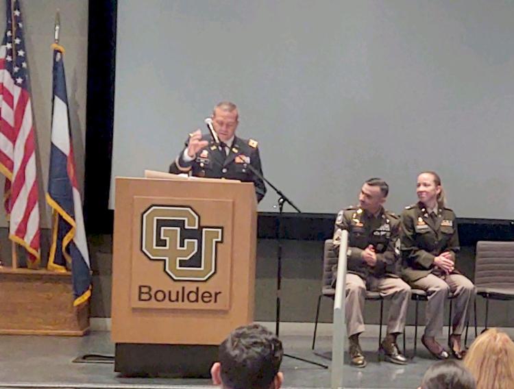 COL David Ray at podium as the guest speaker, sitting to his left is SFC Jacob Thompson and LTC Lynae Place. Photo courtesy of the Golden Buffalo Battalion. 