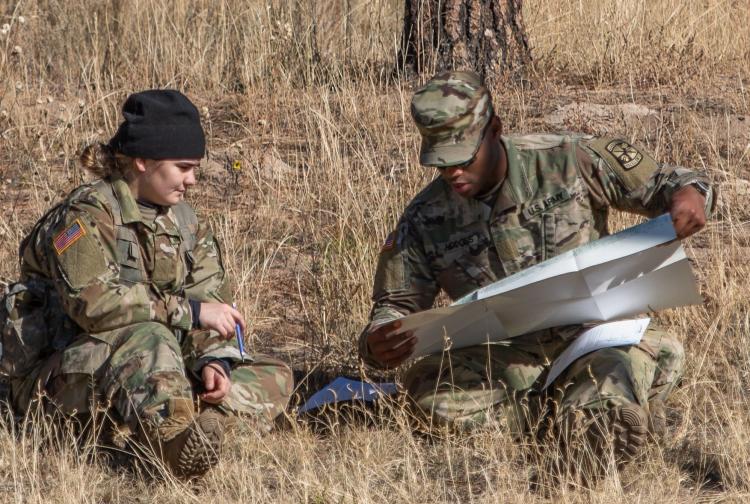 Cadet Hodges assisting a MSI Cadet understand land navigation. Photo courtesy of Cadet Arianna Decker.