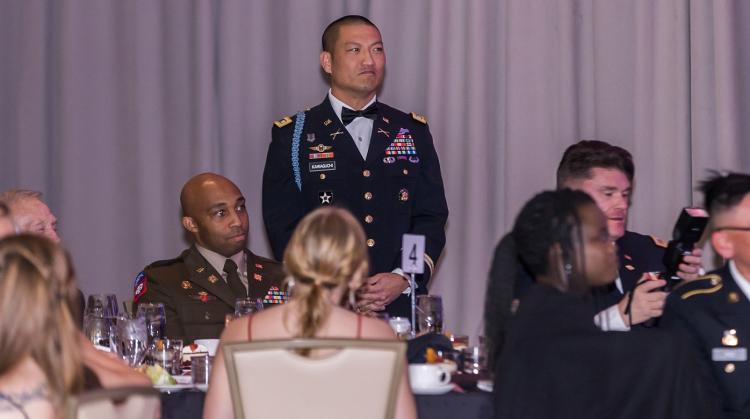 LTC Kawaguchi assigning a Cadet to drink the grog bowl. Photo courtesy Elevate Business Photography.