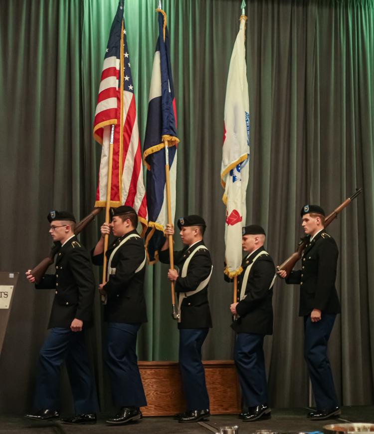 Army ROTC Color Guard retiring of the colors on the event stage. Photo courtesy of the Golden Buffalo Battalion.
