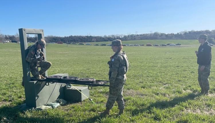 Cadets Fleckenstein and Schomaker working through variables during the Medevac litter carry event. Photo courtesy of Captain Nathan Illies.