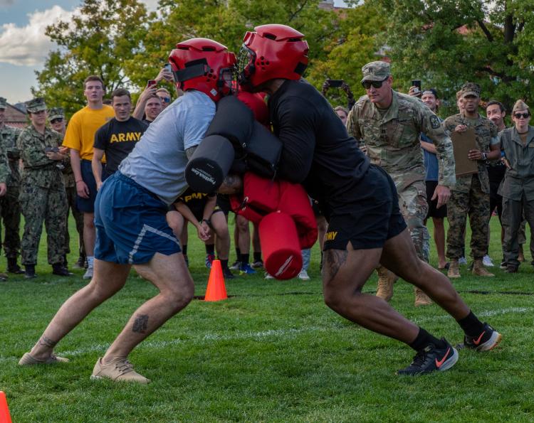 CDT Hodges battles an Airmen Cadet in the pugil sticks match. Photo courtesy of AROTC Cadet Arianna Decker.