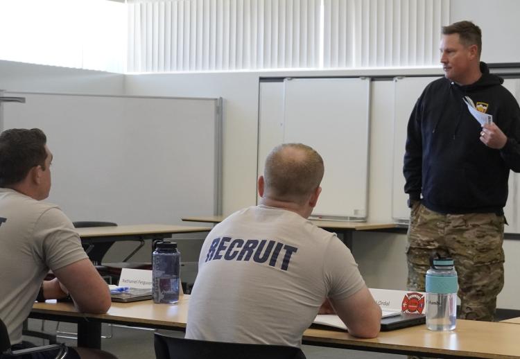 CPT Chris Head reviewing good training and tactics with the new fire fighter recruits. Photo courtesy of CDT William Vlad.