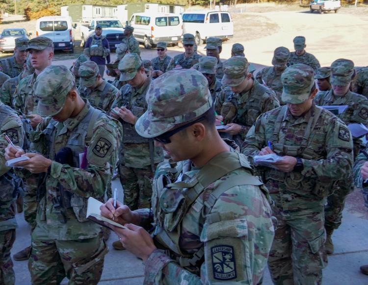 Cadet’s gather to review and take notes on the next planned exercise. Photo courtesy of Cadet William Vlad.