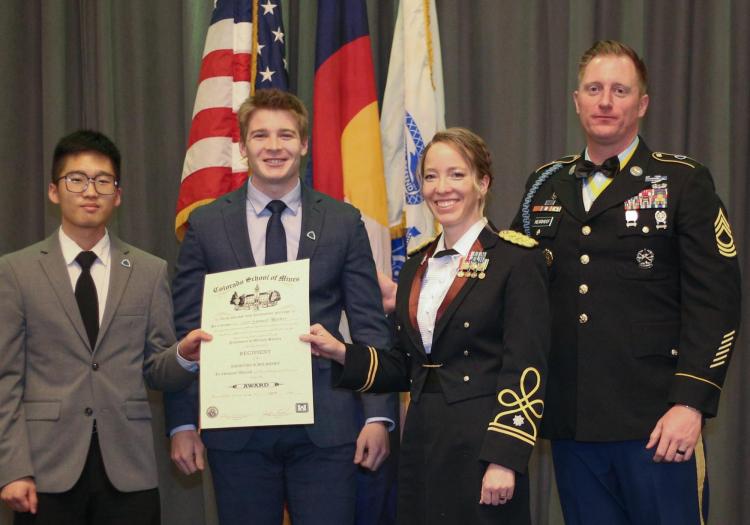 Awarding of the Essayons Scholarship. Pictured from left to right: 2022 winner Cadet Richard Jung, Cadet Samuel Harber, LTC Lynae Place, and MSG Josh Nearhoof. Photo courtesy of the Golden Buffalo Battalion.