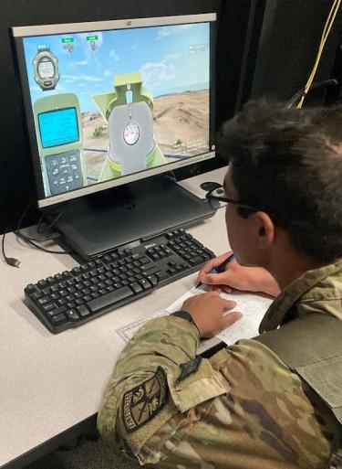 CDT Kao works through the Call for Fire simulation. Photo courtesy of SFC Kevin Marquardt.
