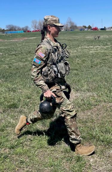 Cadet Jessica Stanfill running with 2- 8 lb kettlebells during Ranger Buddy event. Photo courtesy of Captain Nathan Illies.