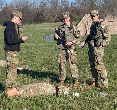 Cadets Sarah Schomaker and Claire Fleckenstein being reviewed during the first aid/medical treatment testing sequences. Photo courtesy of Captain Nathan Illies.