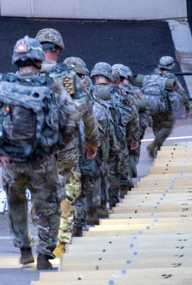 Army ROTC Cadets running down the steps of the Folsom Stadium bleachers. Photo courtesy of CDT William Vlad.